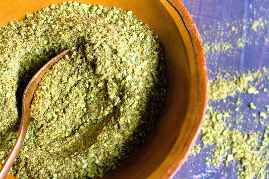 a bowl of ground seeds used for seed cycling
